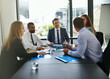 © ThurstanJam/peopleimages.com - Financial, investor or business people in meeting with group for feedback and discussion or teamwork. Corporate review, finance or professional colleagues talking for news, advice and planning online