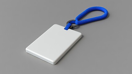 A clean white name tag with a blue lanyard resting on a smooth gray surface in a serene and professional setting