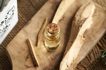 Wall Mural - Essential oil bottle with white sandalwood