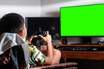 Gamer Playing with Green Screen Monitor