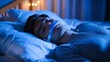 © Lakkhana - Sleep Apnea Solutions illuminated by clear lighting, showing a person using a CPAP machine while sleeping peacefully in bed