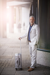 Poster - Mature businessman, suitcase and portrait in city, happy and outdoor on travel with waiting for transport. Person, executive and smile with luggage on sidewalk for trip, taxi and commute in Germany