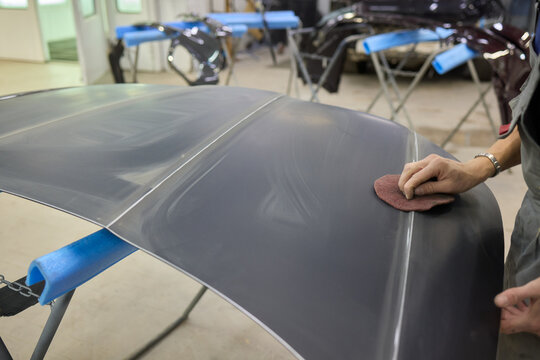 The Auto Body Repair Process involves key steps like sanding and refinishing vehicle parts