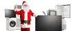 © Ljupco Smokovski - Santa claus with a tv screen and home appliances pointing up
