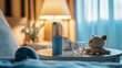 © DIAHIMAGESNEW - A bedside table with a nebulizer, glass of water, and teddy bear.