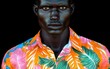 © imagineRbc - A man with a black face and orange shirt with green leaves. The man is wearing a shirt with a floral pattern