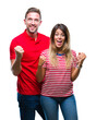 © Krakenimages.com - Young couple in love over isolated background celebrating surprised and amazed for success with arms raised and open eyes. Winner concept.