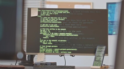 The office of an I.T. company with code on the computers