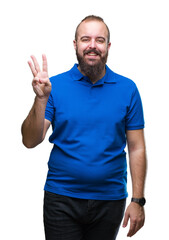 Wall Mural - Young caucasian hipster man wearing blue shirt over isolated background showing and pointing up with fingers number three while smiling confident and happy.