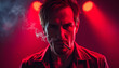 © Sergey - Serious male rocker smoking cigarette and looking at camera on black background in studio with red illumination isolated with white highlights, png