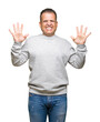© Krakenimages.com - Middle age arab man wearing sport sweatshirt over isolated background showing and pointing up with fingers number ten while smiling confident and happy.