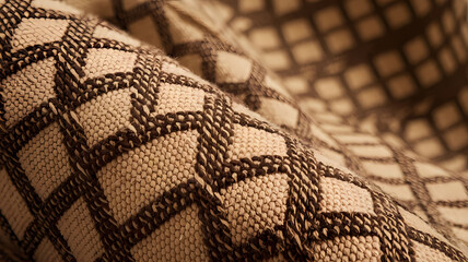 Textured fabric featuring a geometric pattern of brown and beige tones, ideal for upholstery and home decor projects.