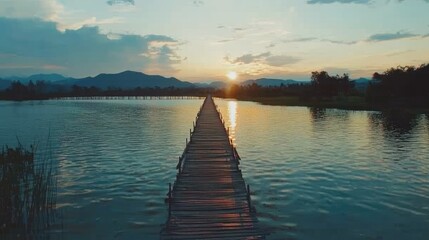 Wall Mural - Serene Sunset Over Lake with Wooden Pathway