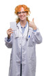 © Krakenimages.com - Young redhead doctor woman holding blank notebook happy with big smile doing ok sign, thumb up with fingers, excellent sign