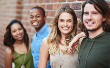 Canvas Print - People, happy and portrait at brick wall for travel, journey and relationship development. Friends, couples and smile on city sidewalk for double date, friendly support and students on study break