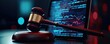 © Rossarin - A gavel rests on a platform beside a digital screen displaying data patterns, symbolizing the intersection of law and technology.