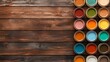 © Paul - Aerial shot of open paint cans in various shades with a matching color palette, positioned on a weathered wooden table, detailed brushstrokes and wood grain