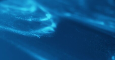 Poster - Blue abstract particle effect with flowing motion, resembling underwater or cosmic scenes. Ideal for video loops, technology, sci-fi, relaxation, and motion graphics.