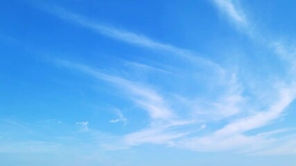cloudscape, a timelapse of a beautiful blue sky with unique white clouds, for a background