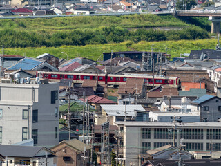 Wall Mural - 大阪府柏原市の市街地を通る近鉄道明寺線の電車