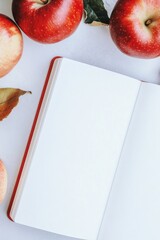 Poster - Minimalist Apple-Themed Magazine Mockup with Blank Pages and Fresh Red Apples on White Background