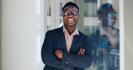 Poster - Arms crossed, glasses and portrait with business black man at window in office for confidence or professionalism. Ambition, mission and smile with happy corporate employee in workplace for career
