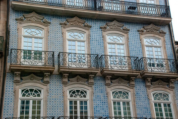 Facade of typical Portuguese houses in Porto with tiles - Portugal 