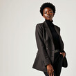 © kenpaul - A dark-skinned woman with short afro hair, wearing a stylish blazer and turtleneck, posing elegantly against a clean white background, perfect for modern fashion and branding