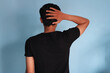 © Lailar Studio - back view asian man confused while holding head