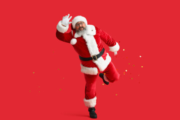 Dancing Santa Claus on red background