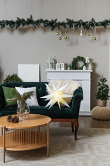 Wall Mural - Interior of festive living room with green sofa, wooden coffee table and Christmas decorations