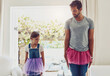 © SometimesNever/peopleimages.com - Man with girl, ballet dancing and teaching with learning at home in tutu, bond with love and creativity. Family, father and daughter dance in living room, ballerina lesson and spending time together
