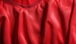 © Rindi - Red sports clothing fabric football jersey texture close up
