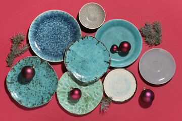 Wall Mural - Beautiful table setting with Christmas balls and fir branches on color background