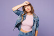 © ViDi Studio - Young sad woman she wear denim jacket violet top casual clothes hand on forehead suffer from headache look camera isolated on plain pastel light purple background studio portrait. Lifestyle concept.