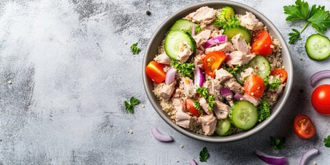 Poster - Food dieting concept featuring tuna salad. Couscous salad with canned tuna, tomatoes, cucumbers, and purple onions on a table. Copyspace.
