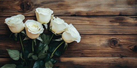 Poster - White roses on a wooden surface. Selective focus, copy space.