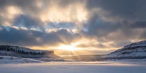 Poster - Sunlight breaking through the clouds in the winter sky.
