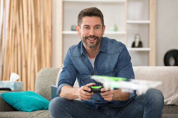 guy flying a drone indoors