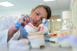 © auremar - dental technician working in laboratory preparing false teeth