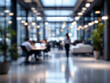 © Zahid - A blurred image of a modern office space with people working at work
