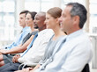 © peopleimages.com - Listening, diversity and business people in audience for seminar, workshop or conference. Group, employees or colleagues in presentation for staff training, development or convention at workplace