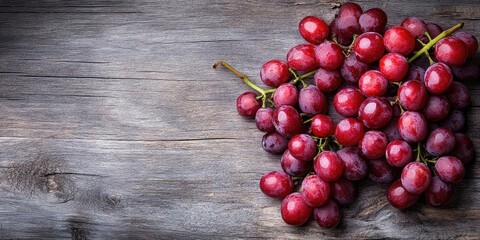 Poster - Red grapes on a wooden surface.