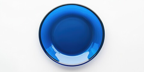 Wall Mural - Plate isolated against a white background. Blue empty dish. A top view of a flat arrangement.