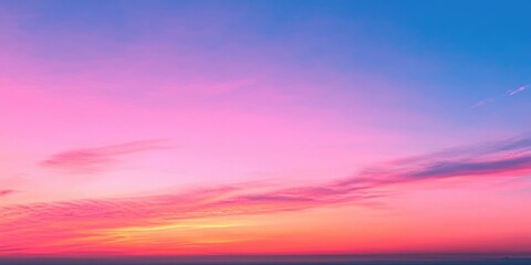 Poster - The clear sky transformed into a stunning gradient of oranges and pinks at sunset.