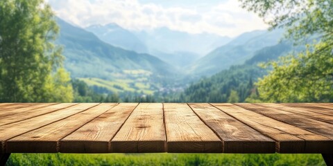 Poster - Empty wooden table with a blurred background of a summer landscape in a mountainous region. Suitable for displaying or showcasing products.