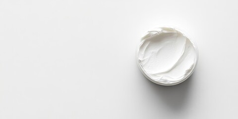 Poster - Cosmetic cream isolated on a white background with copy space, top view, close-up.