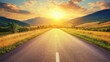 © logyartstudios - A scenic mountain road stretches into the distance under a vibrant sunset sky.
