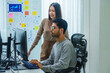 © weedezign - asian and Indian Developer team discussion feedback analysis coding data with software computer at office