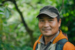 © Татьяна Евдокимова - Asian park ranger in nepal's forest, smiling and working to protect nature, embodies the spirit of conservation on a sunny day